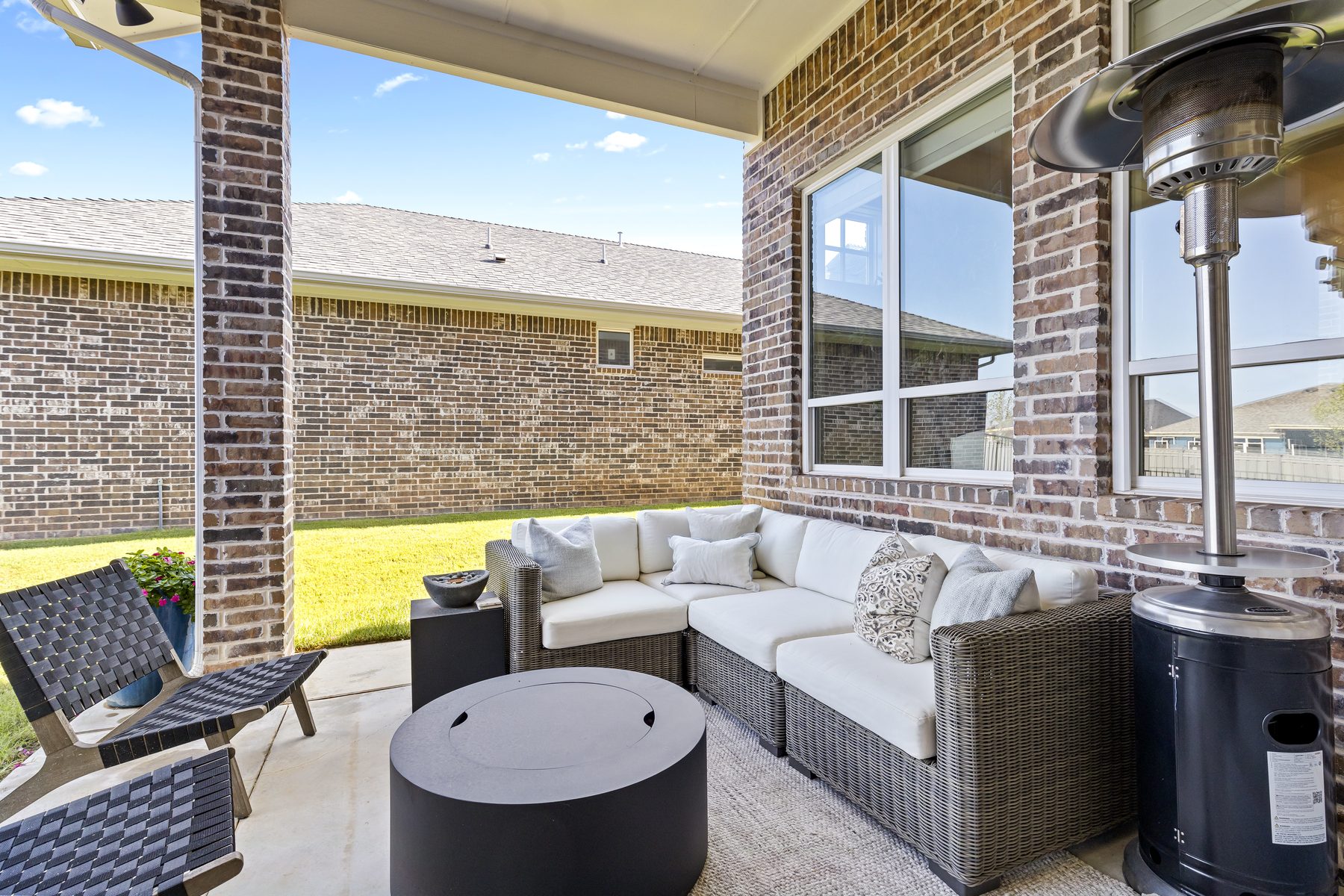 Backyard with covered patio seating area
