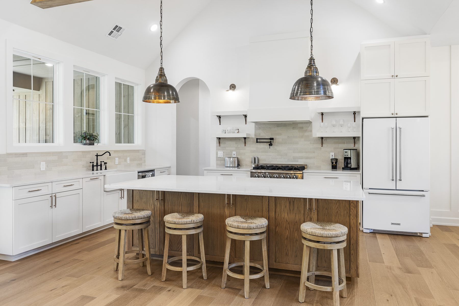 Open-concept kitchen with bright finishes